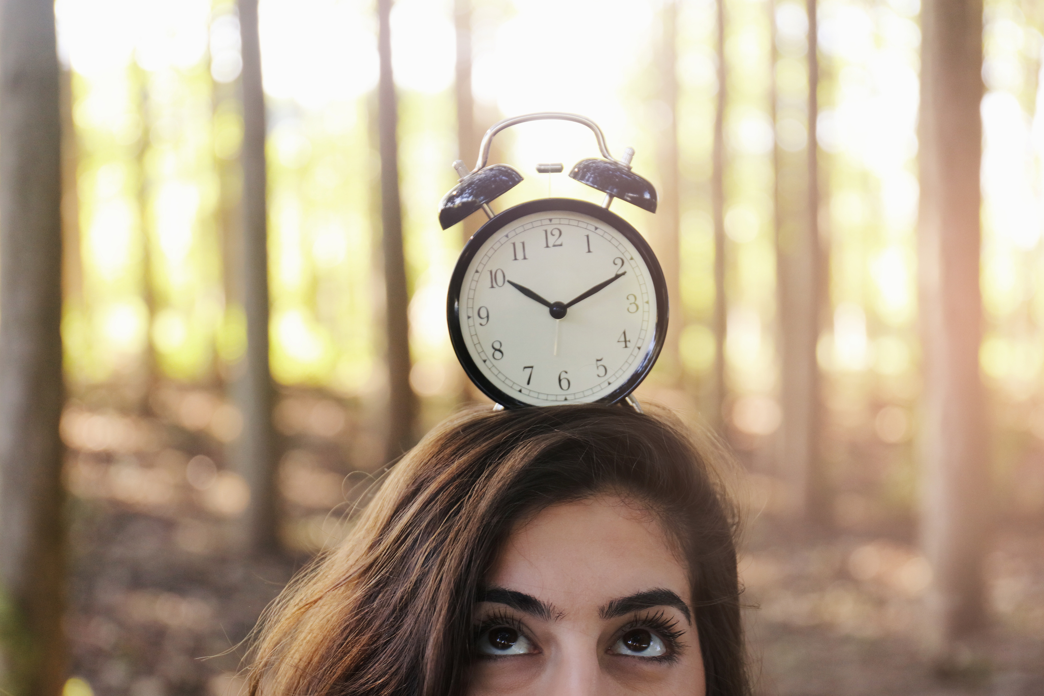 Woman with alarm clock